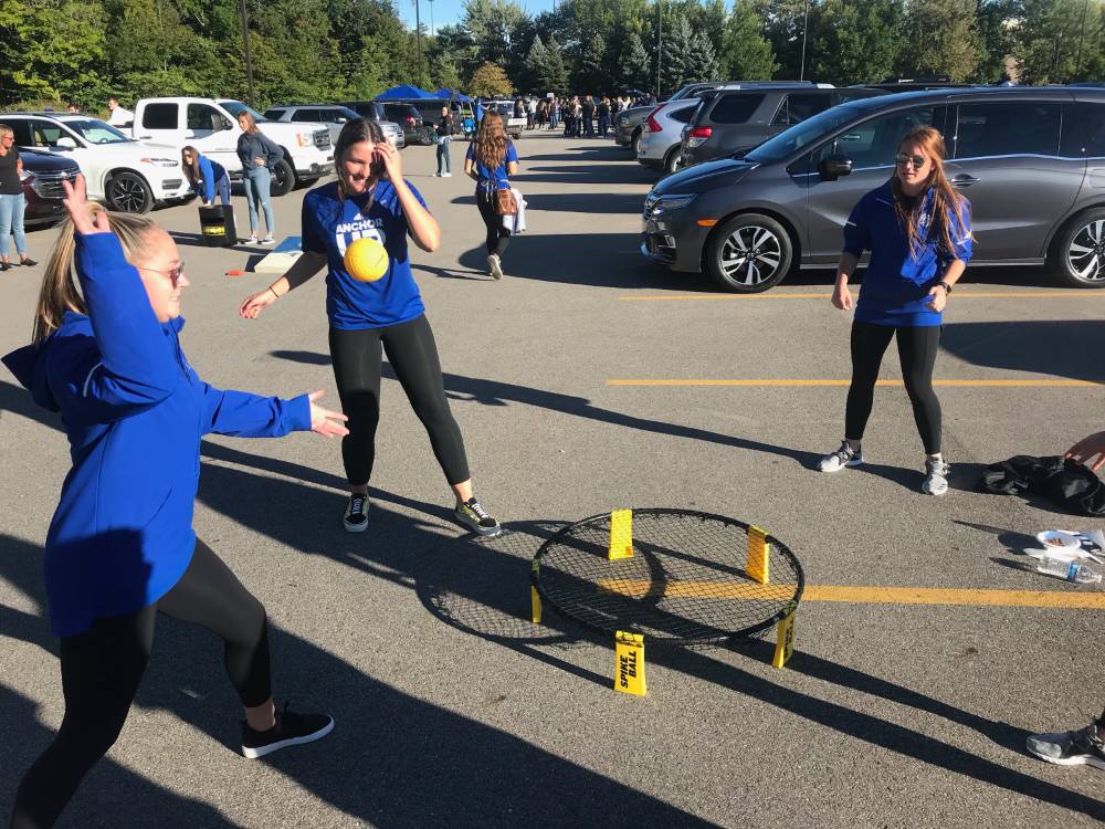 Students playing spike ball at tailgate